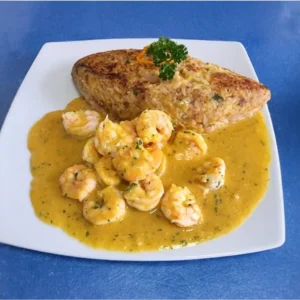 Tacu tacu con salsa de langostinos